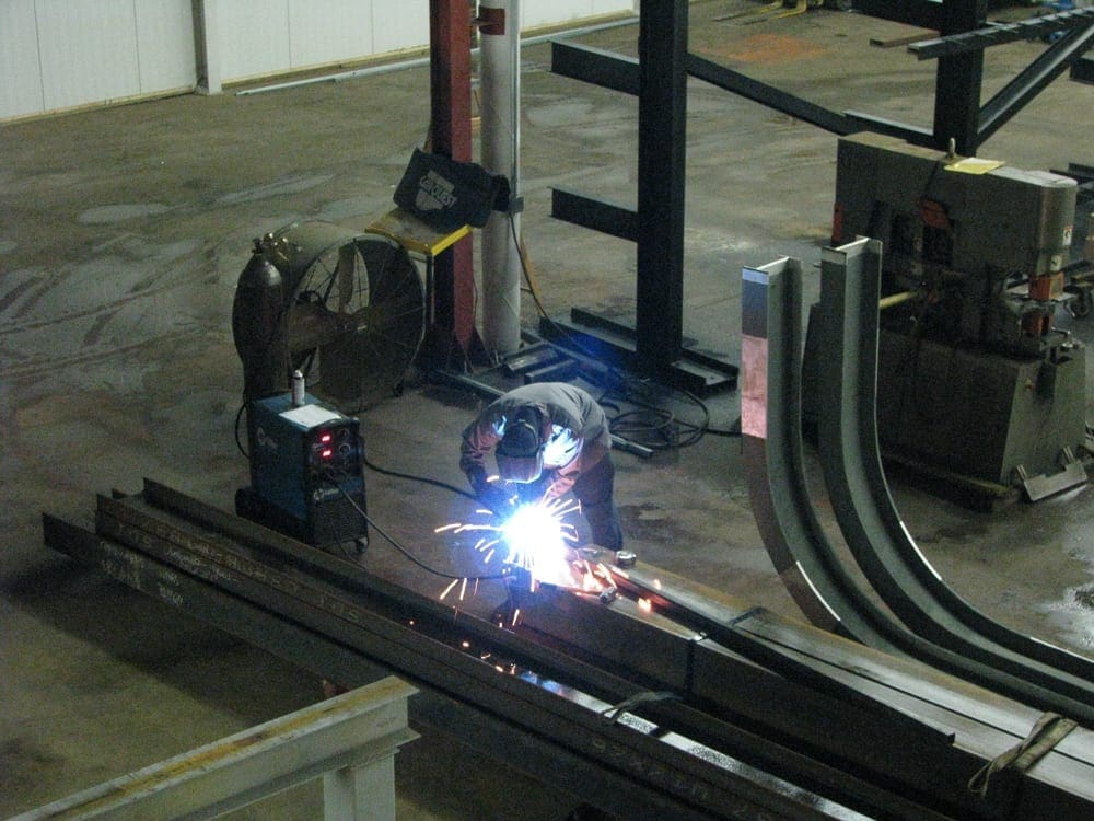 Attachments being welded to crane runway columns