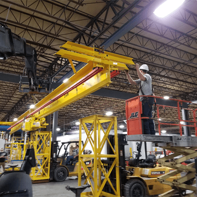 CraneWerks technician performing an installation of an overhead bridge crane