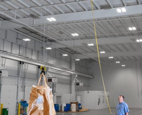 Crane Operator lifting the Top-Running, Single Girder Overhead Bridge Crane by CraneWerks, Inc. at Kimura America in Shelbyville, IN