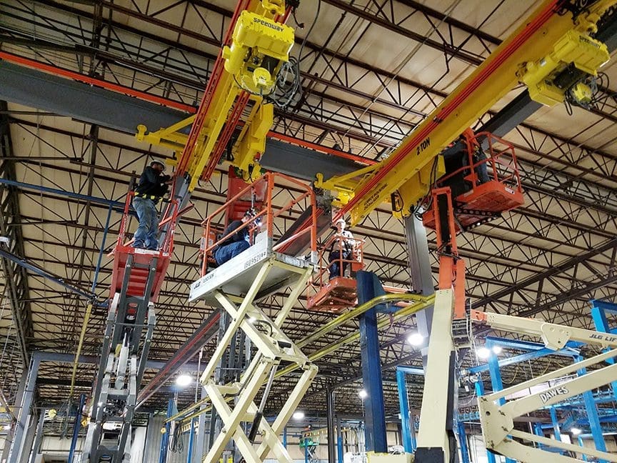 Crew of men working on Ceiling Supported Monorail by CraneWerks of Morristown, IN
