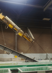 Catastrophic underhung overhead bridge crane runway fail, broken runway hanging loose from ceiling mount at metal finishing plant in central Indiana