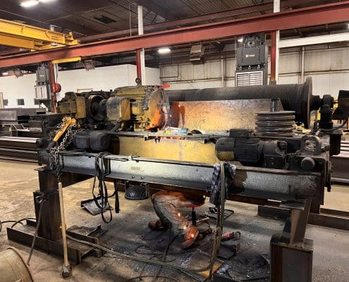 Overhead crane rehabbed by CraneWerks for Service Crane Company's steel processing customer