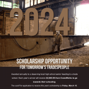 The former Roger Graham pictured with a down overhead bridge crane, promoting the scholarship opportunity for tomorrow's tradespeople, awarded annually to a deserving local high school senior heading to a trade school. Each year's winner is awarded $2,000 from CraneWerks to go towards their schooling.
