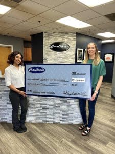 Solnahomi "Sol" Jimenez-Mendoza being awarded the $2,000 2024 Roger Graham Scholarship by Ashley Larochelle of CraneWerks, Inc. in Morristown, IN